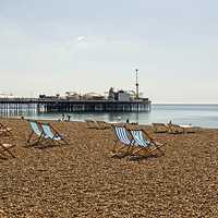 Buy canvas prints of Deckchairs and Brighton Pier by VICTORIA HENDRICK