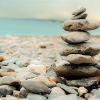 Buy canvas prints of Pebble Tower on the beach by Andrew Lee