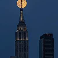 Buy canvas prints of Super Moon In An Empire State Of Mind by Susan Candelario
