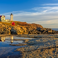 Buy canvas prints of Nubble Lighthouse Reflections by Susan Candelario