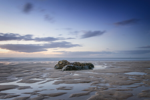 Porthmeor beach rocks at sunset Picture Board by Jonathan Thirkell