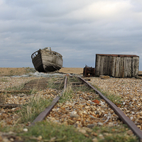 Buy canvas prints of  Old Boat at Dungeness  by Rebecca Giles