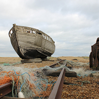 Buy canvas prints of  Old Boat at Dungeness by Rebecca Giles
