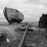 Buy canvas prints of  Old Boat at Dungeness by Rebecca Giles