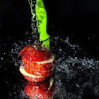 Buy canvas prints of Fresh Apple slices drenched with water by Jonny Essex