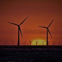 Buy canvas prints of Windmills at Sunset  by John Wain