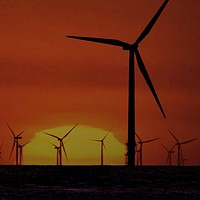 Buy canvas prints of Windmills at Sunset  by John Wain