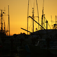 Buy canvas prints of Fishing Boats at Sunset by John Mitchell