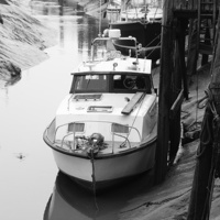 Buy canvas prints of Boats in Creek by Les Hardman