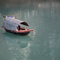 Buy canvas prints of Halong Bay fishing boat by Jed Pearson
