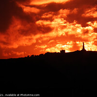 Buy canvas prints of Fiery sunset over Carn Brea, Cornwall  by Brian Pierce