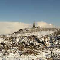 Buy canvas prints of Carn Brea and the Basset Monument in Winter  by Brian Pierce