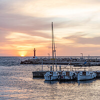 Buy canvas prints of Majestic Sunrise Over Cala Bona Harbour by Graham Custance