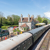 Buy canvas prints of Majestic Corfe Castle and Steam Train by Graham Custance