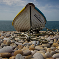 Buy canvas prints of Chesil Beach boat by Graham Custance