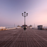Buy canvas prints of Cromer Pier Sunrise by Graham Custance