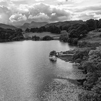 Buy canvas prints of Loughrigg Tarn and the Langdale Pikes monochrome by Graham Moore