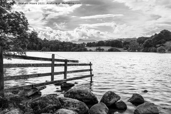 Old fence at Loughrigg Tarn monochrome Picture Board by Graham Moore