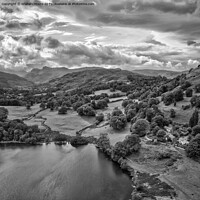 Buy canvas prints of Loughrigg Tarn looking west towards the Langdale Pikes monochrom by Graham Moore