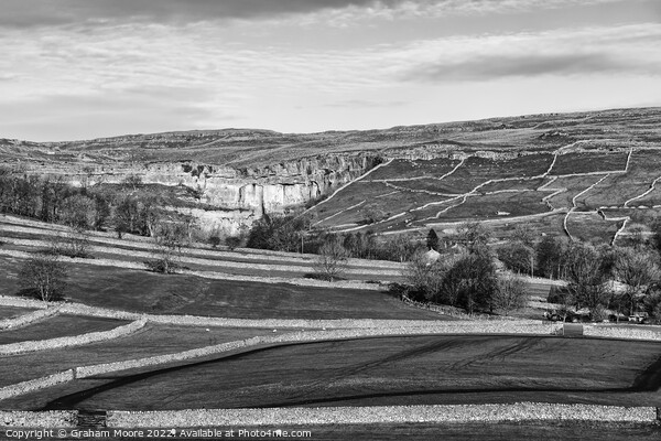 Malham Cove and surrounding fields monochrome Picture Board by Graham Moore