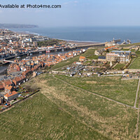 Buy canvas prints of Whitby town harbour and Abbey headland by Graham Moore