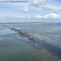 Buy canvas prints of holy island causeway near high tide by Graham Moore