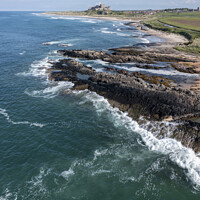 Buy canvas prints of Bamburgh Castle from Harkness Rocks elevated by Graham Moore
