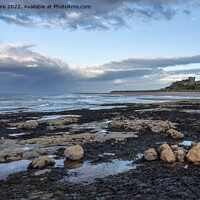 Buy canvas prints of Bamburgh Castle from Harkness Rocks dusk by Graham Moore