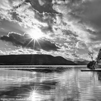 Buy canvas prints of Ullswater boathouse with sun flare monochrome by Graham Moore