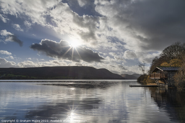 Ullswater boathouse with sun flare Picture Board by Graham Moore