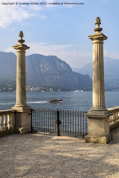 Lake Como terrace  and motorboat Picture Board by Graham Moore