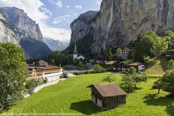Lauterbrunnen village and Staubbach falls Picture Board by Graham Moore