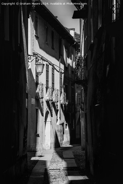 Old street in Orta Italy monochrome Picture Board by Graham Moore
