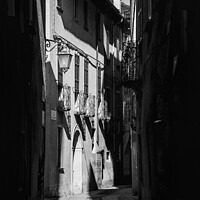 Buy canvas prints of Old street in Orta Italy monochrome by Graham Moore