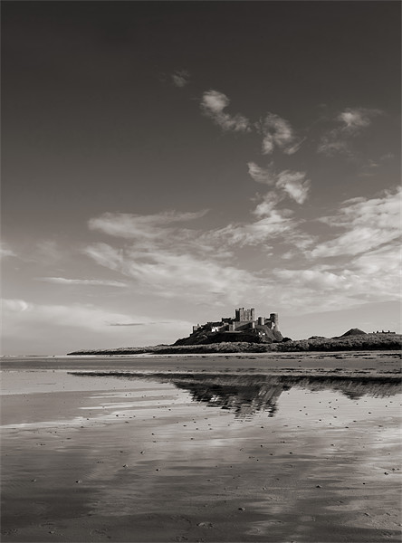 Bamburgh Castle reflections Picture Board by Graham Moore