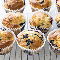 Buy canvas prints of Fresh home baked blueberry muffins by Graham Moore