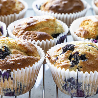 Buy canvas prints of Fresh home baked blueberry muffins by Graham Moore