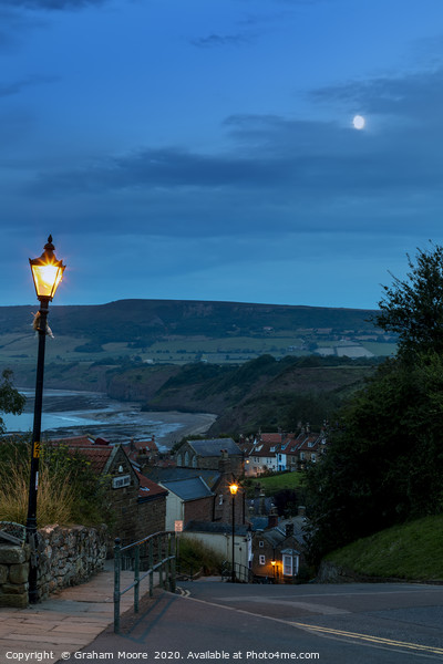 Robin Hoods Bay street evening Picture Board by Graham Moore