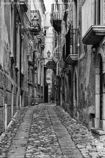 Tropea street monochrome Picture Board by Graham Moore