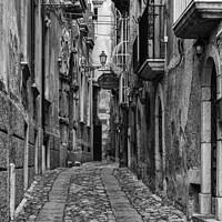 Buy canvas prints of Tropea street monochrome by Graham Moore