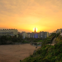 Buy canvas prints of Sun Going Down Over Tenby by Martin Chambers