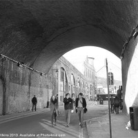 Buy canvas prints of A Stroll under the arches by David Wilkins