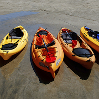 Buy canvas prints of Beached Sea Kayaks by Karen Magee