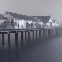 Buy canvas prints of Southwold Pier vanishing into the mist by Karen Magee