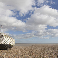 Buy canvas prints of  Fishing boat basking on the beach. by Howie Marsh