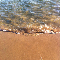 Buy canvas prints of Playful waves lapping the shore by Esther  Walker