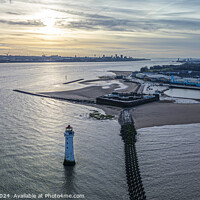 Buy canvas prints of New Brighton lighthouse and Liverpool Waterfront at sunrise by Paul Madden