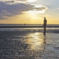 Buy canvas prints of Crosby Beach Iron Man Sunset by Paul Madden