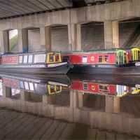Buy canvas prints of canal barges under bridge by Paul Madden