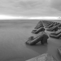 Buy canvas prints of Incoming tide at dusk B+W by Paul Madden